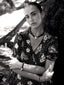 Black and white model image of Venessa Arizaga FW26 Venus Heart Necklace (Black) - A statement necklace with black glass beads, pave accents, and a gold heart pendant, FW26 Venus Heart Bracelet (Black) - An everyday adjustable bracelet with black threadwork, glass beads, pave accents, and a gold heart pendant, and Lover Bracelet - An everyday adjustable bracelet with black threadwork, black glass seed beads, and rhinestone heart charms