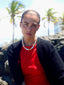 Model image of Venessa Arizaga FW26 Talk of The Town Necklace - A statement gold beaded necklace with ceramic letter charms spelling "me", "you", "hi", "bye", "yes", "no", "omg"