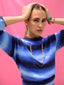 Model wearing Venessa Arizaga SS26 Color Crush Necklace layered with Love in Color adjustable Necklace worn as a choker, Peace Out Sparkle earrings, with Color Crush Bracelet and stacked Bright side Rainbow charm and cord bracelets for everyday colorful wear