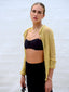 Model wearing Happy Mood Key bracelet on wrist, featuring colorful dyed jade beads and gold key charm