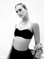Venessa Arizaga SS26 Good Vibes Only Necklace draped at the collarbone, smiley charms dancing against bronzed skin for happy-go-lucky salt-air resort energy and SS26 whimsical layering in monochrome.