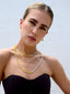 Venessa Arizaga SS26 Good Vibes Only Necklace draped at the collarbone, smiley charms dancing against bronzed skin for happy-go-lucky salt-air resort energy, with sparkling stud and charm dangling earrings - Peace Out Sparkle Earrings and Smiley Sparkle Earrings, perfect for radiating happiness and positivity.
