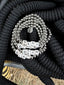 Lifestyle image of Venessa Arizaga FW26 Blah Blah Blah Bracelet (Silver)  - A statement five-row silver beaded elastic bracelet with ceramic letter charms spelling "blah".