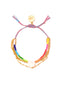 Venessa Arizaga SS26 Rainbow Aura Bracelet — adjustable blue/coral threadwork with rainbow glass and mother-of-pearl heart charm on multi-row gold chains; colorful aura radiating self-love and joy.