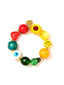 Venessa Arizaga FW26 Over The Rainbow Bracelet - A colorful elastic beaded bracelet with rainbow gradient charms including heart, flower, smiley, eyeball, and ladybug in ceramic, wood, and glass.