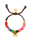 Venessa Arizaga FW26 Stardust Kiss Bracelet - A colorful adjustable bracelet with brown threadwork, colorful beads, pave accents, and a gold star pendant.