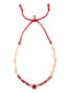 Venessa Arizaga Hidden Cove Necklace - An adjustable necklace with red threadwork, natural shell charms, red shell chips, pave rhinestone accents, and a red rhinstone centerpiece.
