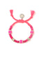 Venessa Arizaga Island Muse Bracelet - An adjustable bracelet with pink threadwork, glass charms, shell charms, and pave rhinestone accents.