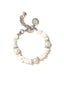 Venessa Arizaga Chasing Tides Bracelet - A beaded bracelet with silver plated brass hardware, shell charms, pearl charms, and pave rhinestone accent.