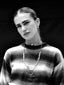 Black and white model image wearing Venessa Arizaga SS26 Color Crush Necklace, adjustable beaded threadwork and chains, layered with Love in Color adjustable glass bead rainbow Necklace worn as a choker, Peace Out Sparkle stud-drop pave earrings, for everyday colorful wear