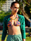 Model image of Venessa Arizaga FW26 Rainbow Reaction Necklace  - A colorful beaded necklace with rainbow jade gradient beads and glass and ceramic charms including lipstick, ladybug, smiley, daisy, mushroom, cactus, eyeball, and alien. Perfect for every day layering.