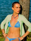 Model image of Venessa Arizaga FW26 Venus Heart Necklace (Rainbow) - A statement necklace with rainbow beads, pave accents, and a gold heart pendant, Venessa Arizaga FW26 Venus Heart Bracelet (Rainbow) - An everyday adjustable bracelet with rust threadwork, colorful beads, pave accents, and a gold heart pendant, and Love Spark Bracelet - adjustable beaded bracelet with rust threadwork, pave accents, and letter beads spelling LOVE with a heart charm