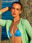 Model image of Venessa Arizaga FW26 Sweetheart Sparkle Necklace (Rainbow) - A statement adjustable  layered necklace with rust threadwork, rainbow seed beads, gold plated chains, rhinestone chain, and a pave heart charm.