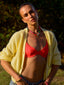 Model image of Venessa Arizaga FW26 Stardust Kiss Necklace - A colorful rainbow beaded necklace with pave accents and a gold star pendant, Stardust Kiss Bracelet - A colorful adjustable bracelet with brown threadwork, colorful beads, pave accents, and a gold star pendant, and Superstar Sparkle Bracelet - A statement adjustable bracelet with brown threadwork, pave accents, letter beads spelling SUPER, and a gold star charm