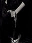 Black & white model image of Venessa Arizaga FW26 Talk of The Town Phone Leash - A statement silver beaded phone leash and bag charm with ceramic letter charms spelling "me", "you", "hi", "bye", "duh", "omg".