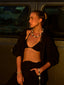 Model image of Venessa Arizaga FW26 Me Me Me Necklace (Silver) - A statement silver beaded necklace with ceramic letter charms spelling “me”, Me Me Me Bracelet (Silver) -  An everyday silver elastic beaded bracelet with ceramic letter charms spelling “me”, and Talk of The Town Phone Leash - A statement silver beaded phone leash and bag charm with ceramic letter charms spelling “me”, “you”, “hi”, “bye”, “duh”, “omg”.