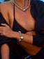 Close up model image of Venessa Arizaga FW26 Big Heart Necklace (Silver) - A silver beaded statement necklace with a large heart pendant, and FW26 Big Heart Bracelet (Silver) -  A silver beaded elastic statement bracelet with a large heart pendant.