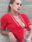 Venessa Arizaga SS26 Dreamy Days Pearl Bracelet wrapped on sun-kissed wrist, Dreamy Days Pearl Necklace layered delicately on the collarbone, and shining Peace Out Sparkle rhinestone stud and pave charm earrings, styled for a carefree vacation look.